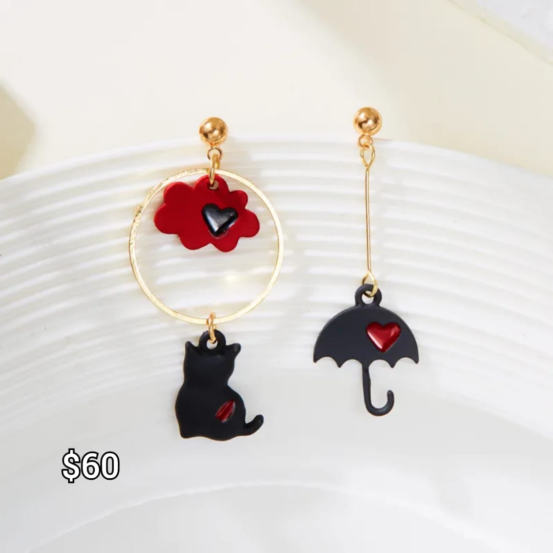 arete gato negro con paraguas