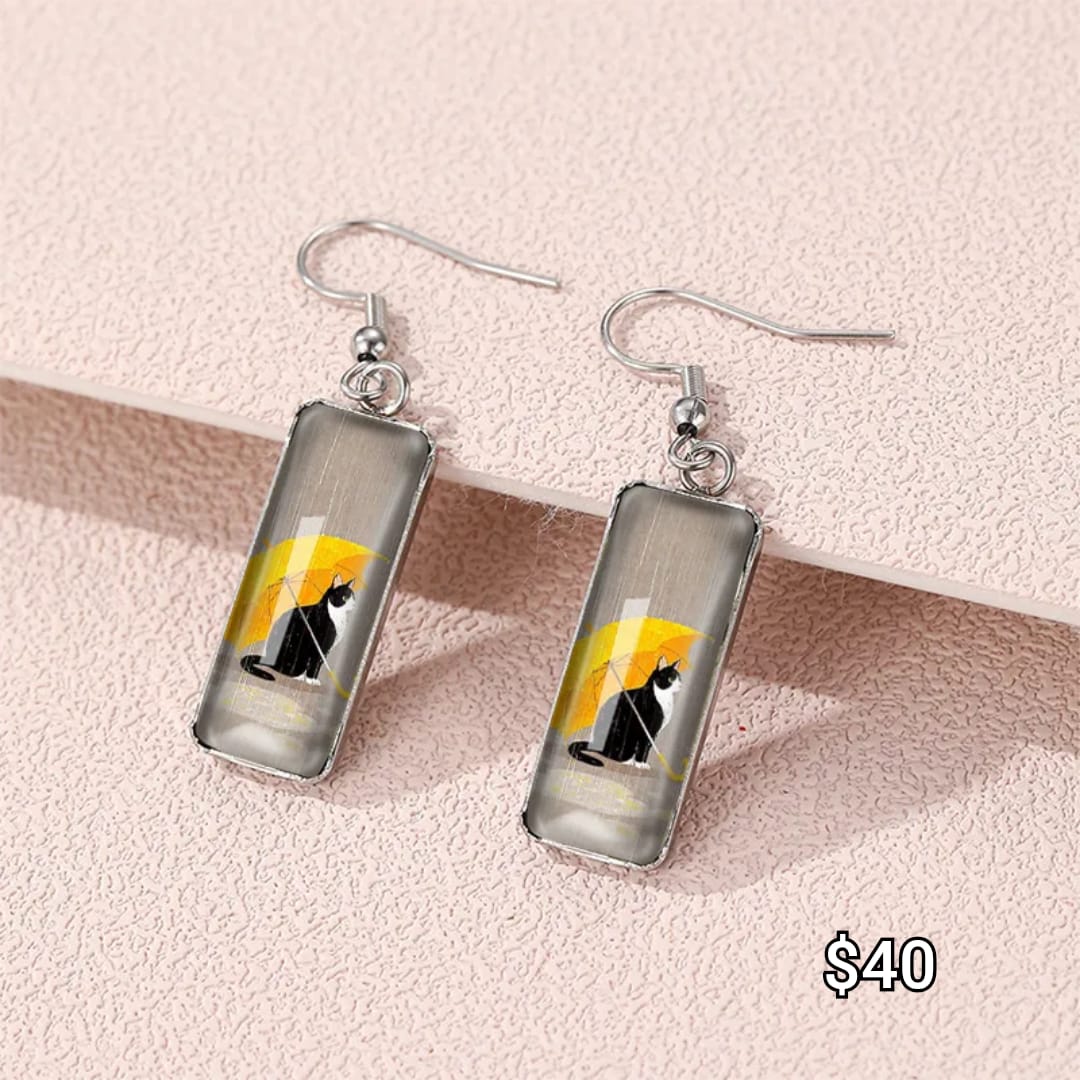 arete de gancho de gato negro con sombrilla