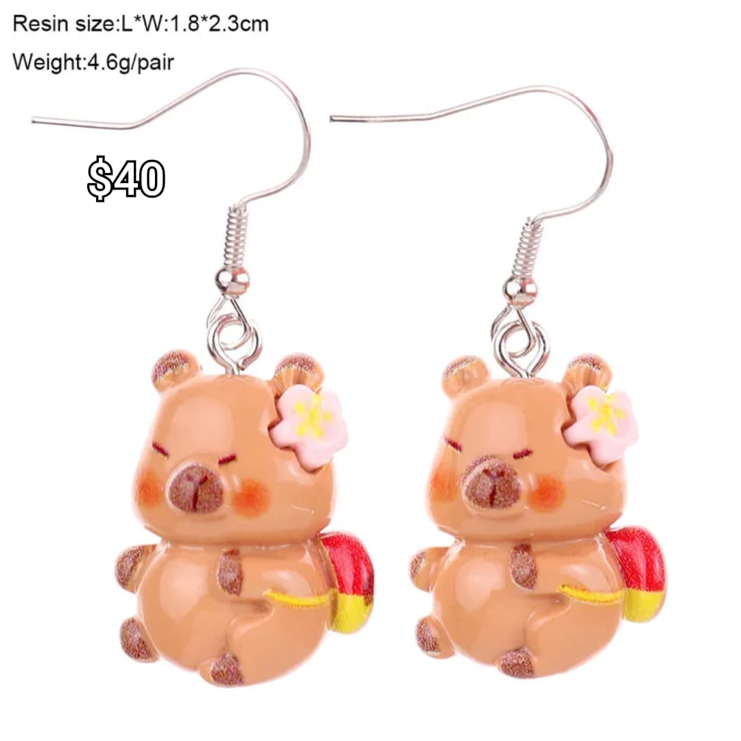 arete capibara mochila y flor